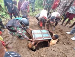 Kurangi Beban Duka Warga, Satgas Yonif 125/SMB Bantu Proses Pemakaman