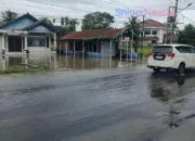 Hujan Deras Sebabkan Genangan Air di Jalan Lintas Sumatera Sei Rampah, Arus Lalu Lintas Melambat